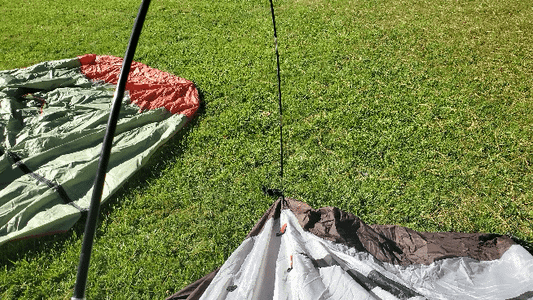 Pull the Tent Upright, Attaching the Second Pole in the Center