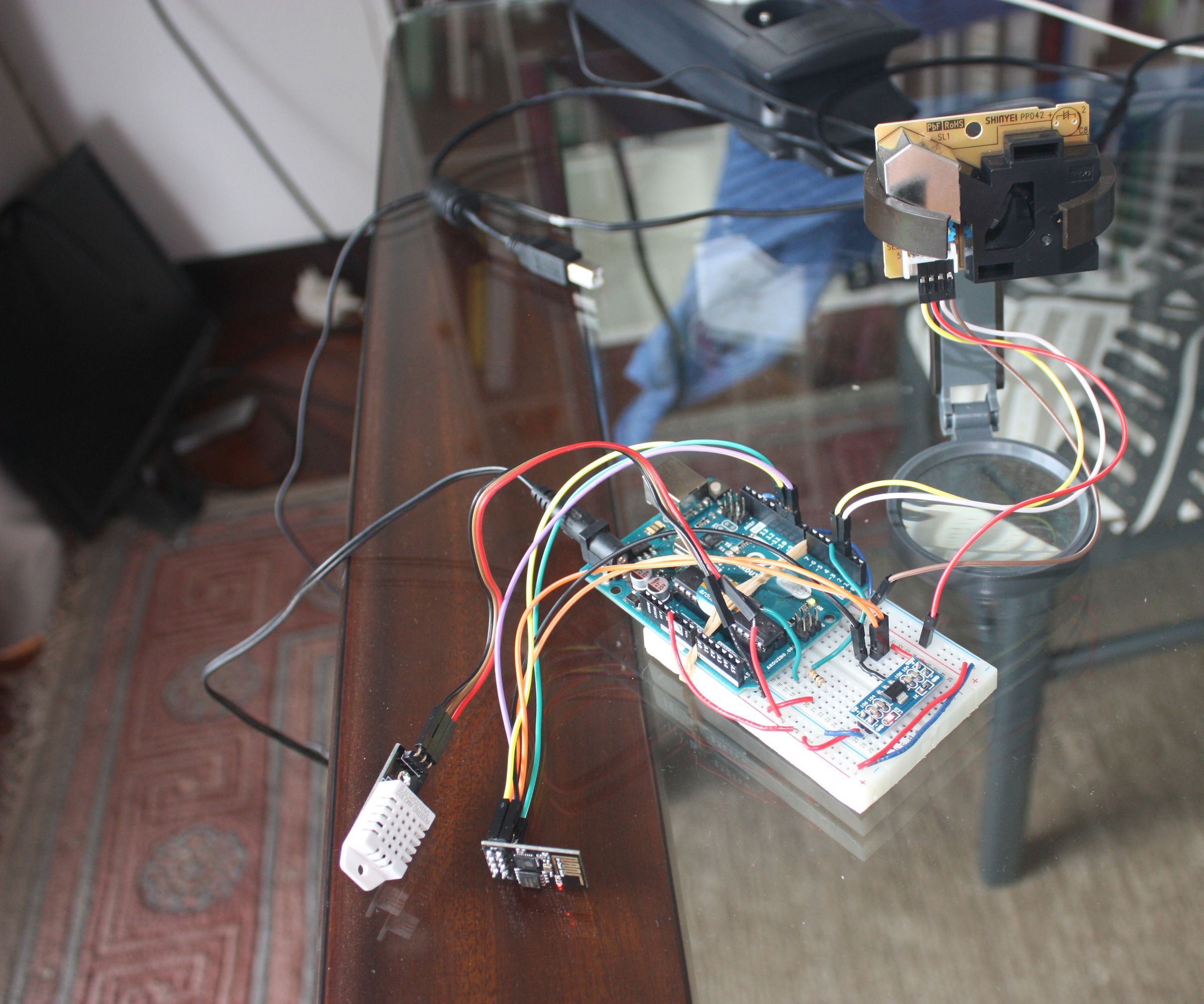 Arduino Dust, Humidity and Temperature Monitor Broadcasted to the Internet With Wifi.