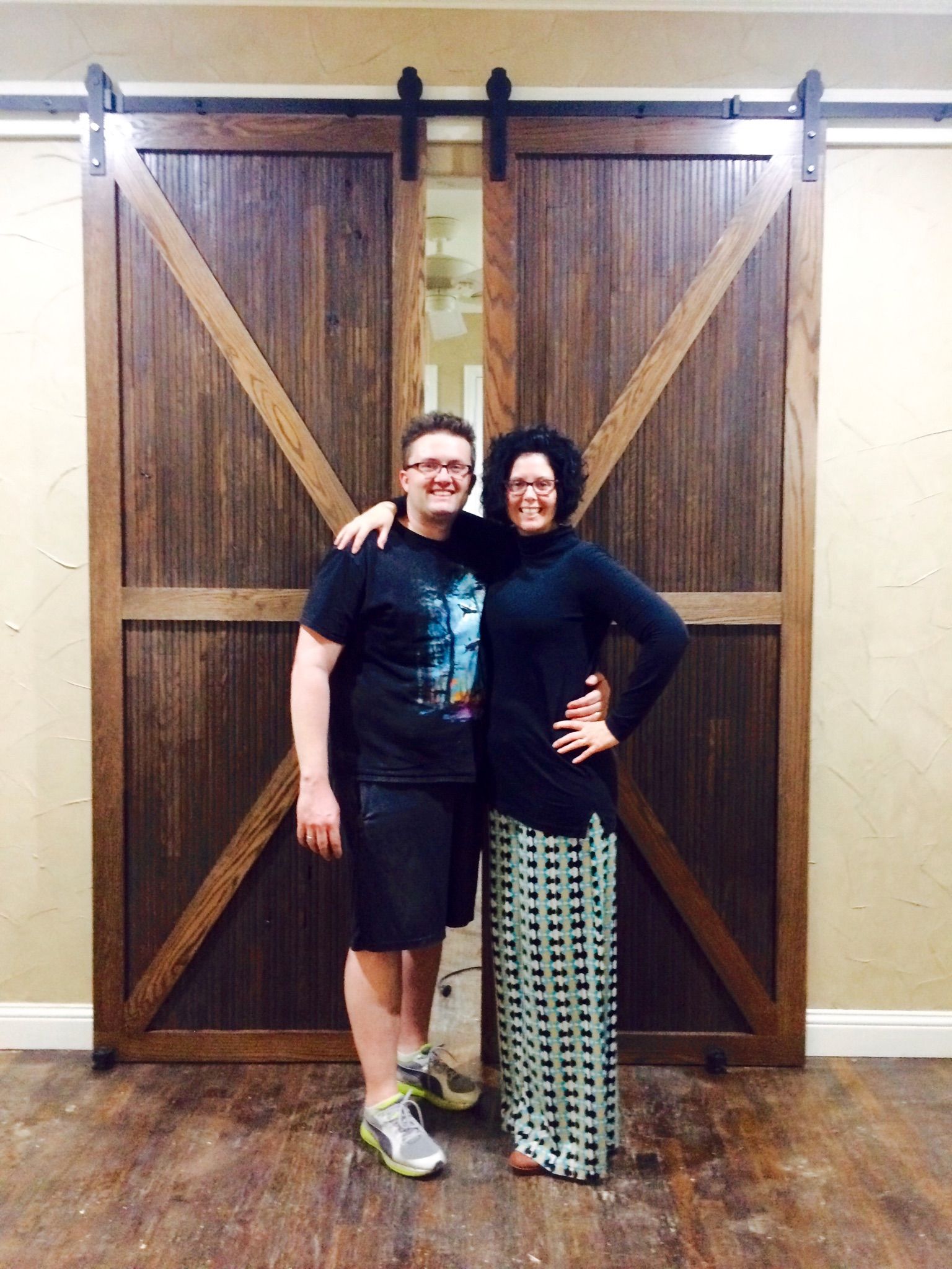 Homemade Biparting Barn Doors Out of Leftover Wood Flooring