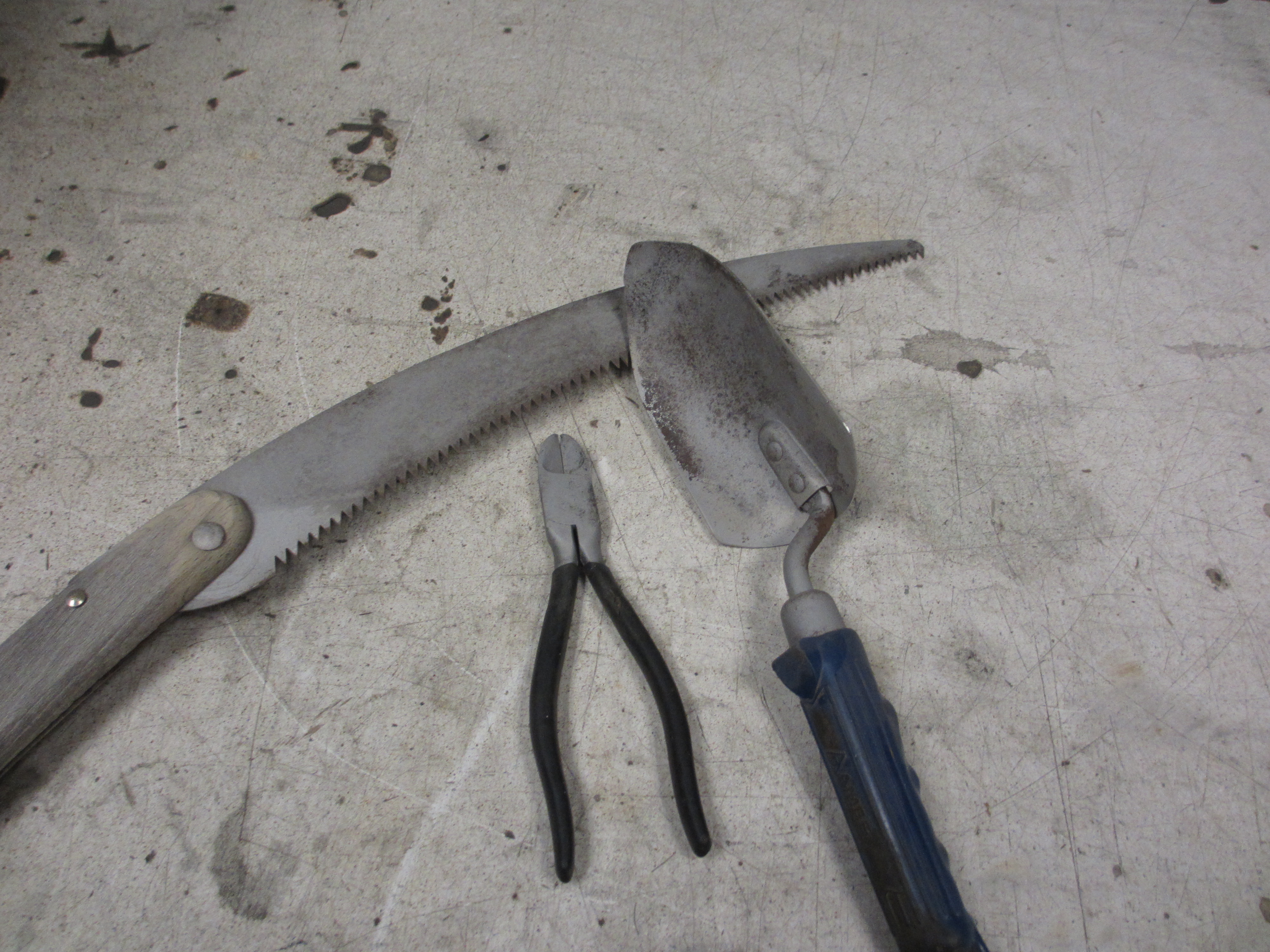 sand blasting the rust away on garden tools