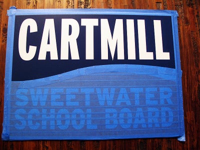 Taping Off and Spray Painting the Sign