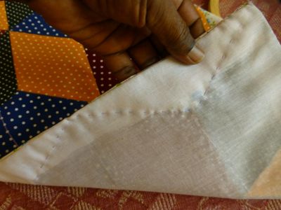 Hand-stitch the Baking to the Design