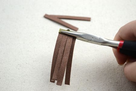 Stuff the Suede Segments Into the Ribbon End. Usually I Prepare 6 Strips for One. Stack Them Into Two Layers