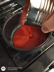Put Tomato Purée Into Saucepan