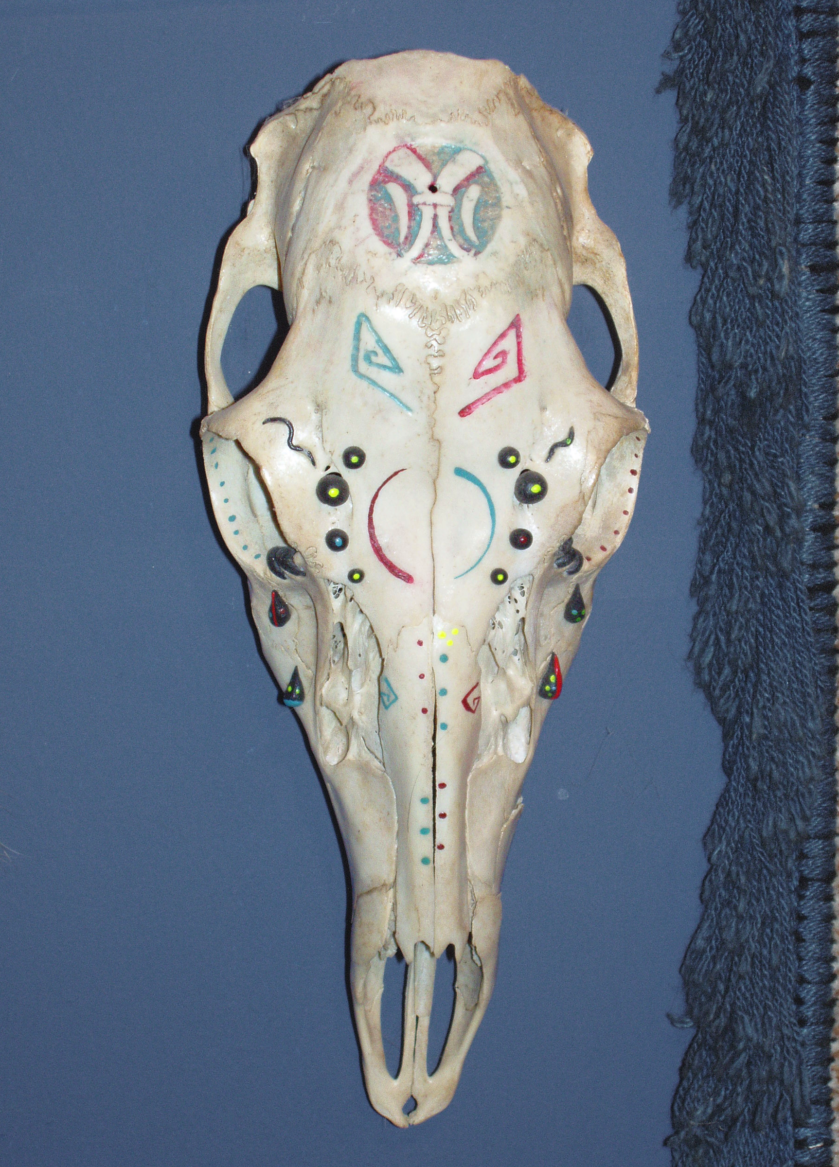 A Carved and Painted Deer Skull