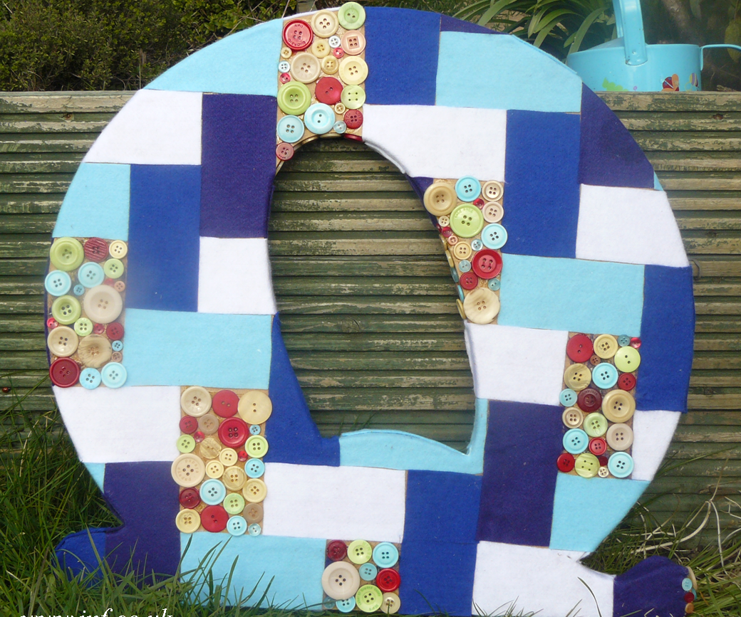 A Giant Patchwork and Button Mosaic Letter