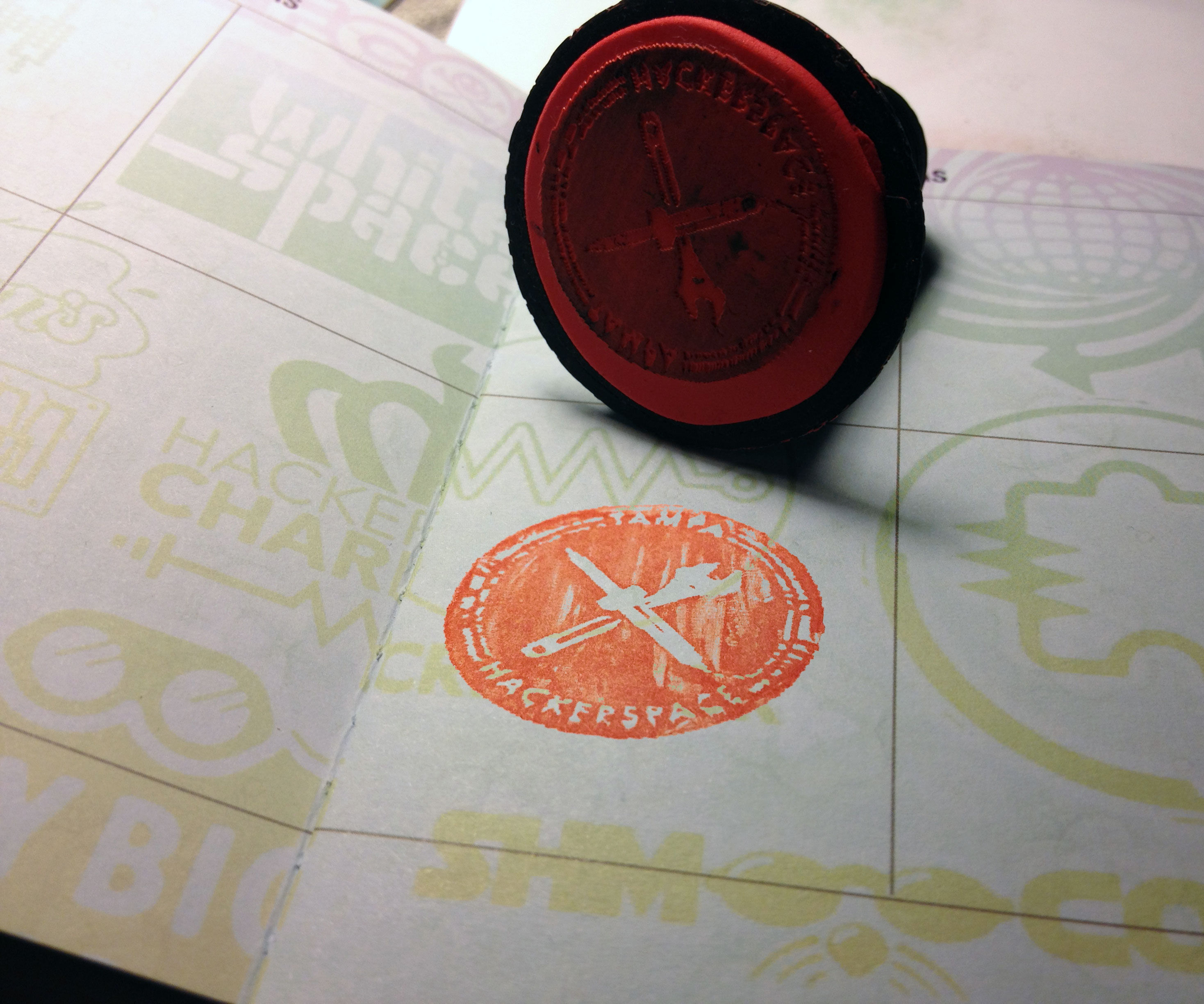 Molding a Hacker Passport Stamp With Sugru, a Laser Engraver, and a 3D Printer