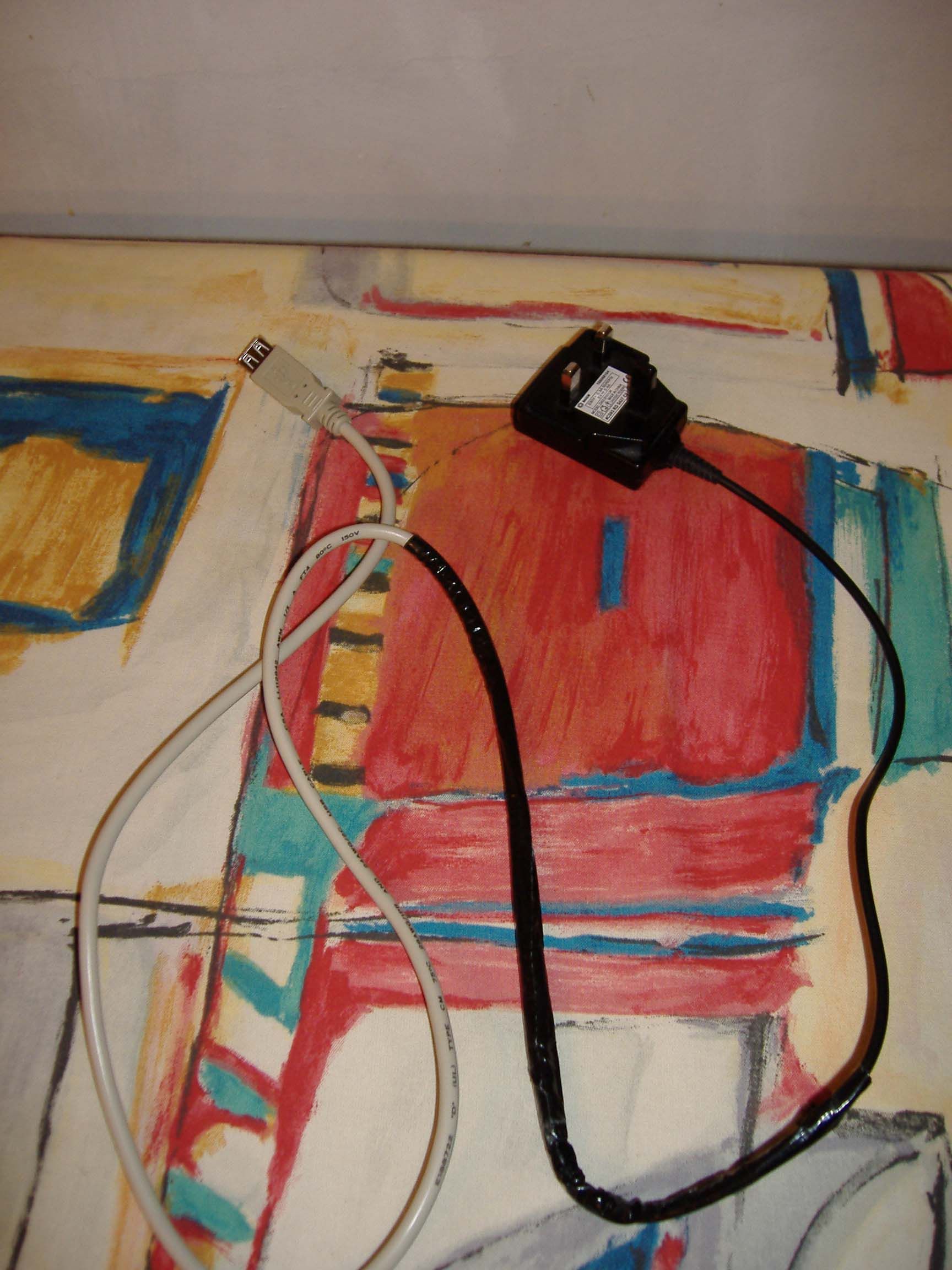 Make a Zen Micro/USB Wall Charger From a Phone Charger