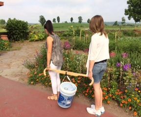 Two person Bucket Buddy for carrying heavy buckets