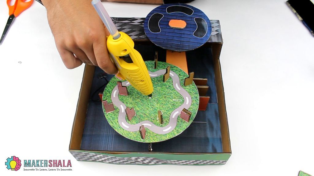 Carefully Place the Disc on Motor Shaft and Secure It With Glue Gun.