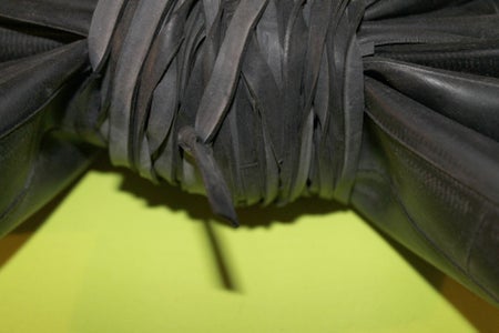 Tie Off the Rubber Thread and Tuck in the Strands From the Knot.