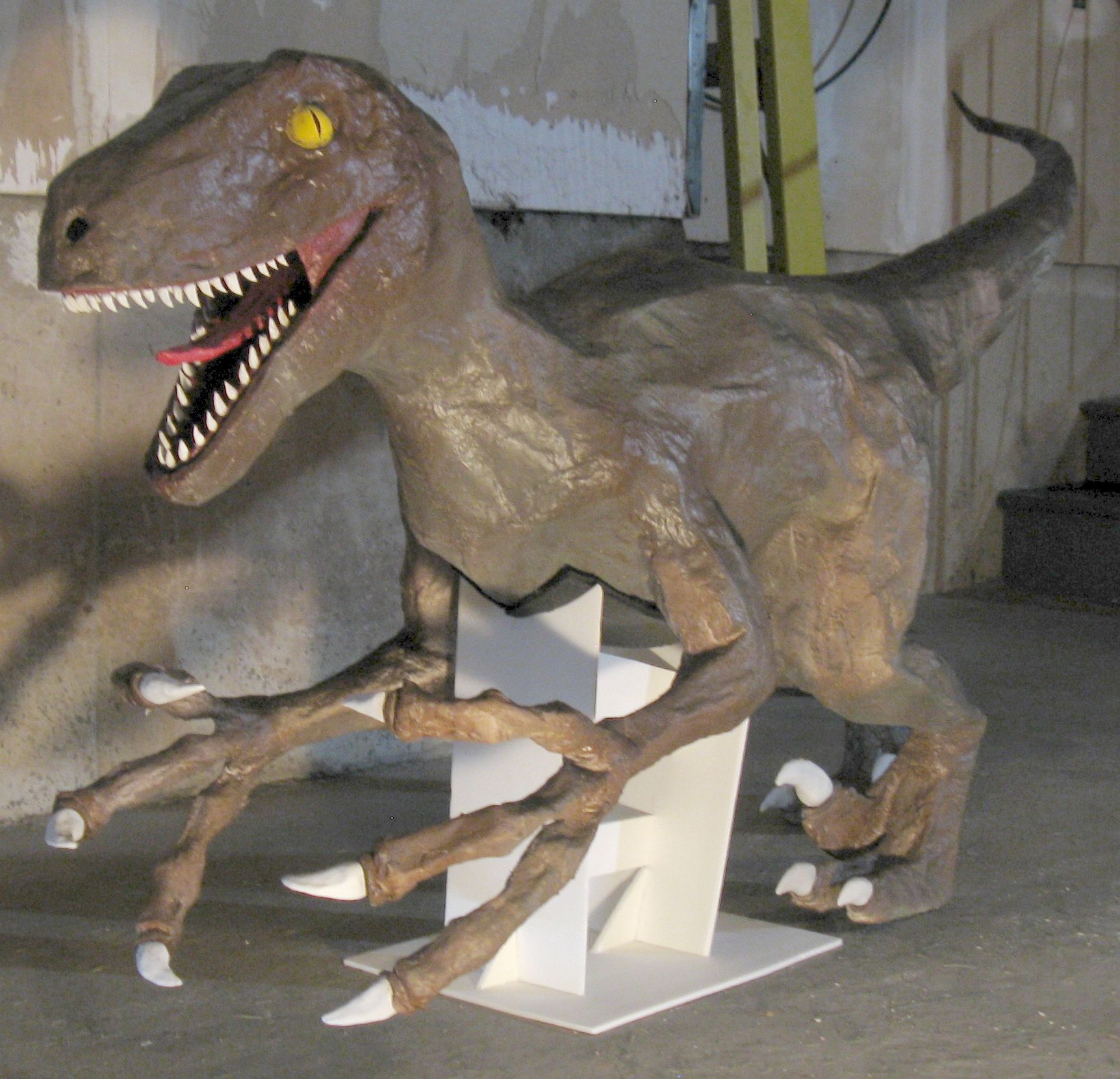Velociraptor Statue and T-Rex Head