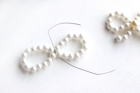 Make a Loop With Two Beaded Wire Segments. Twist at the Marked Position. Finally, Tie a Tightly Knot for Secure.