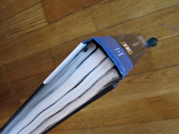 Breaking Heavy Textbooks in to Smaller Books for Easy Carrying.