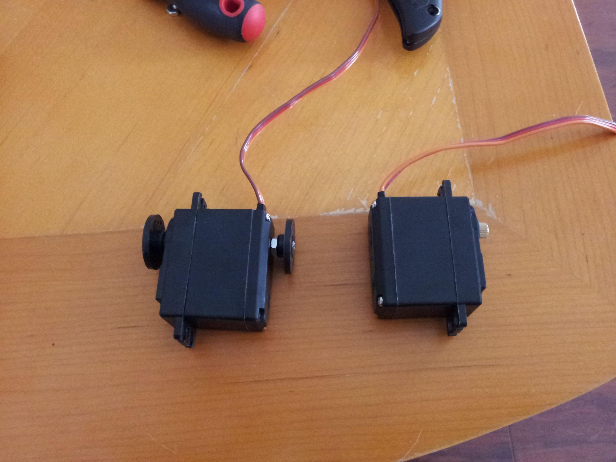 Add hinge pin to servos for joint motion