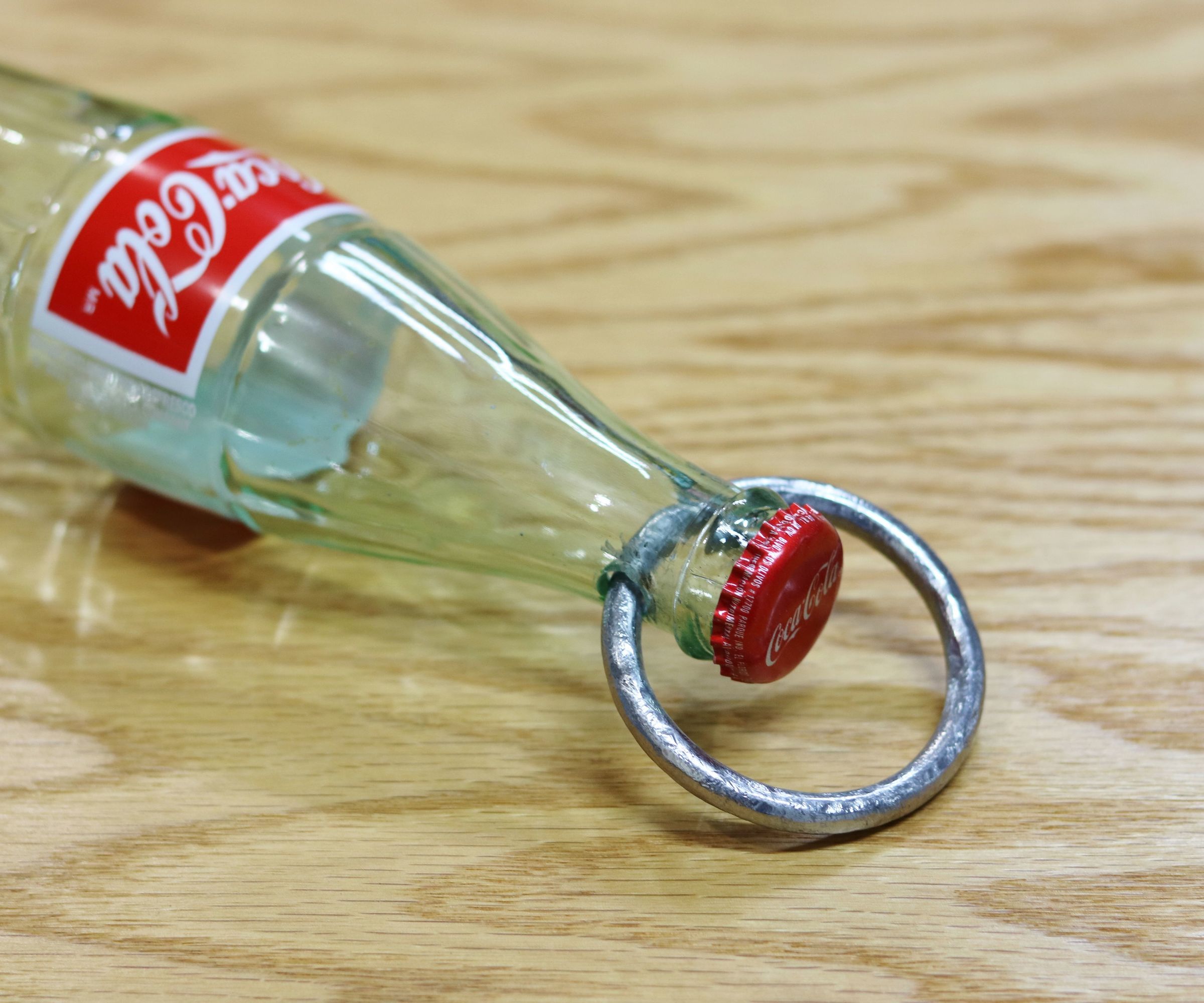 Impossible Metal Ring Through Coke Bottle