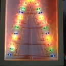 A Luminous Christmas Tree in a Picture Frame, Made From Old Light Strip Bulbs