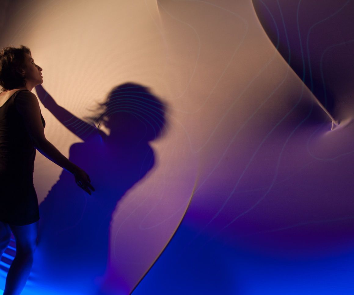 Breathing Wall: Projection Mapping Onto a Moving Surface  Using a Depth Camera 