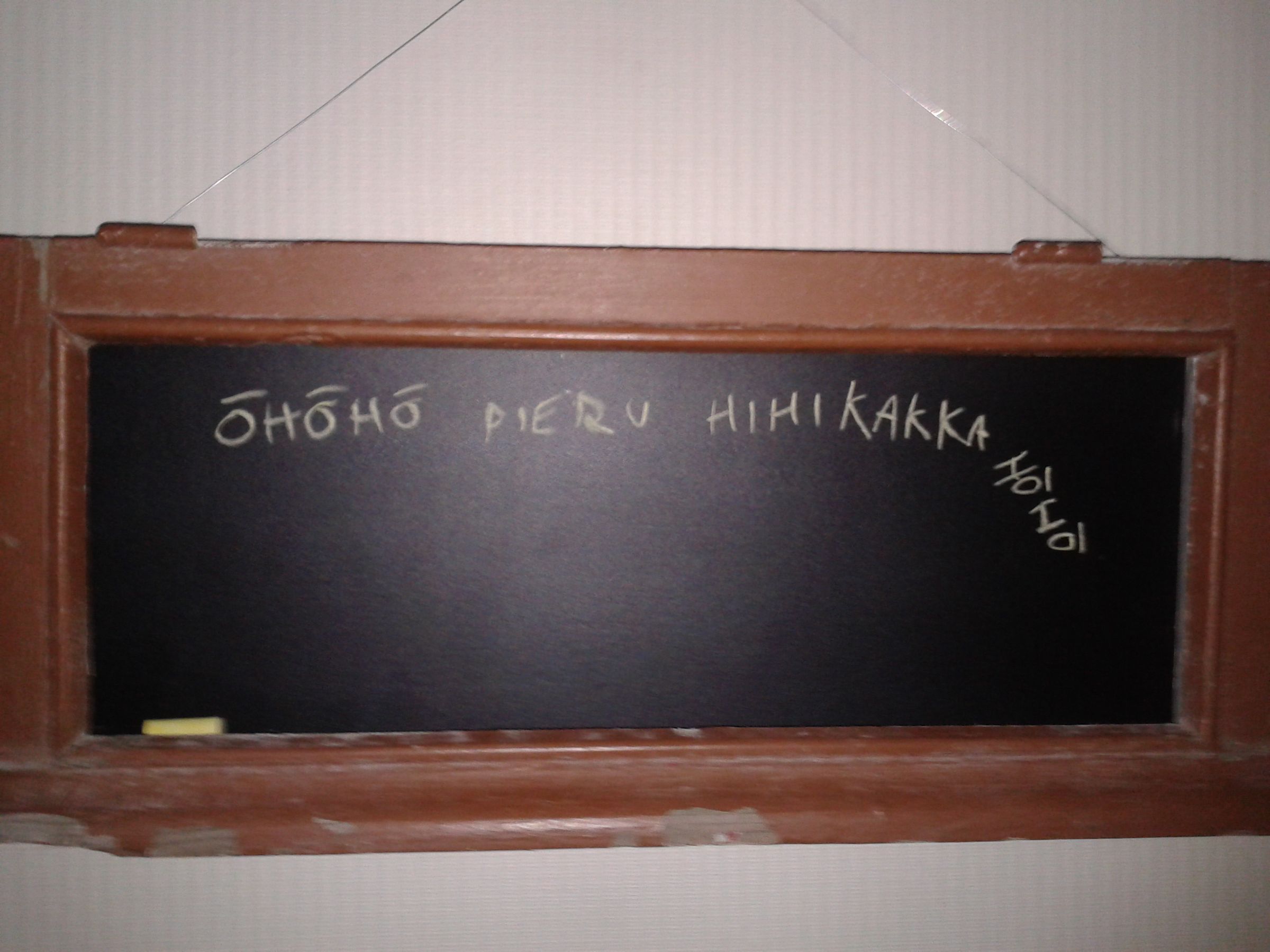 A chalkboard made from an old window frame