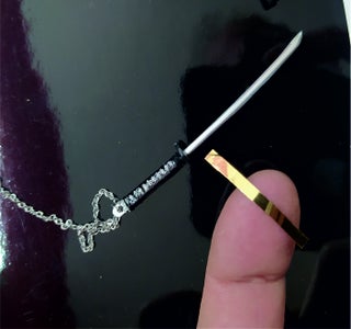 HANGING IN CHAIN, DECORATING THE BLADE.