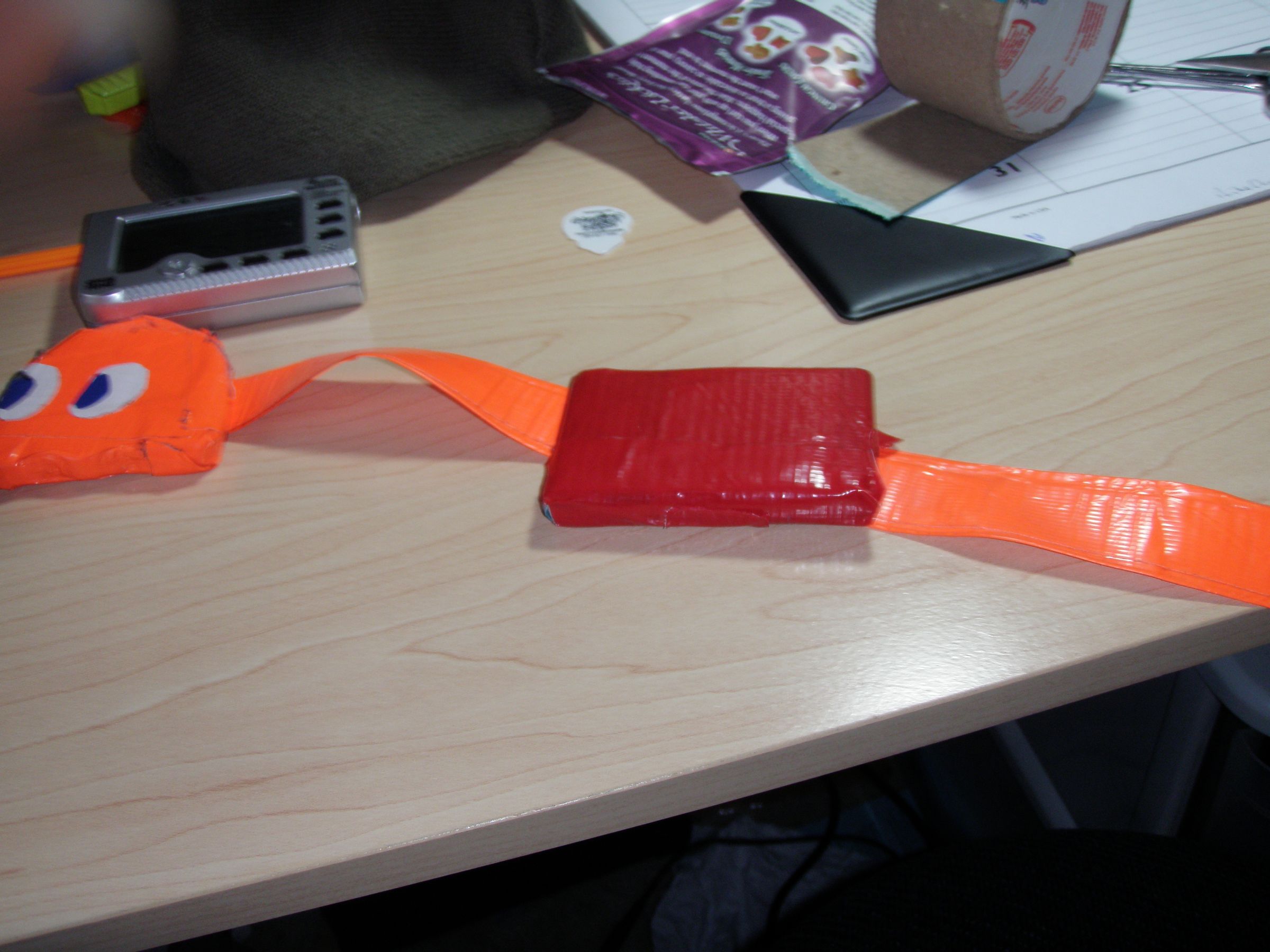 How to make a duct tape case for handheld devices.