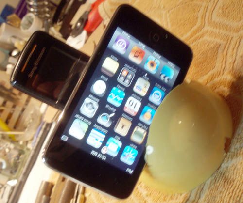 A Dual Ipod  and  Mobile  Telephone Charger Base