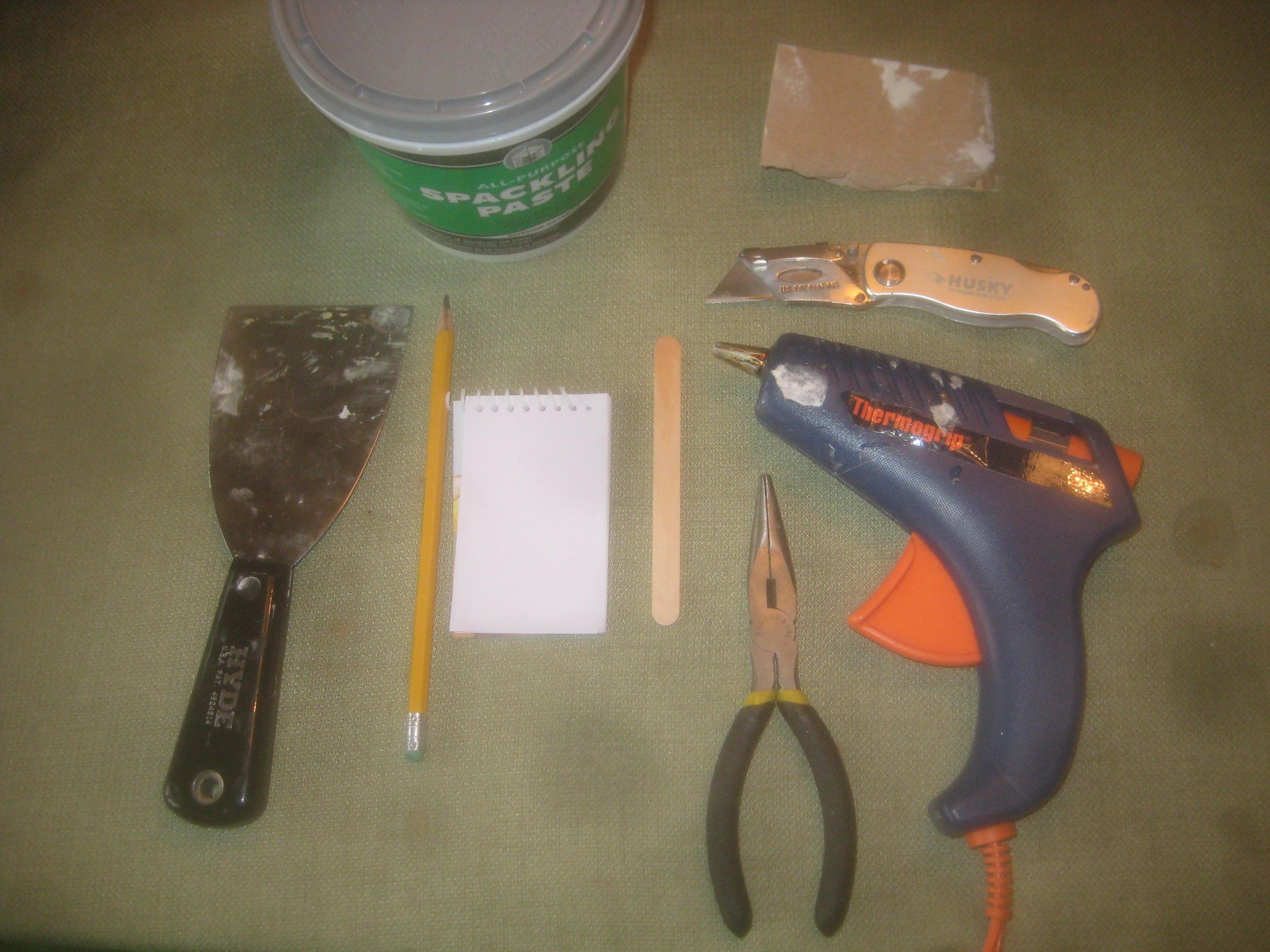 A Trick For Patching Drywall Using Hot Glue