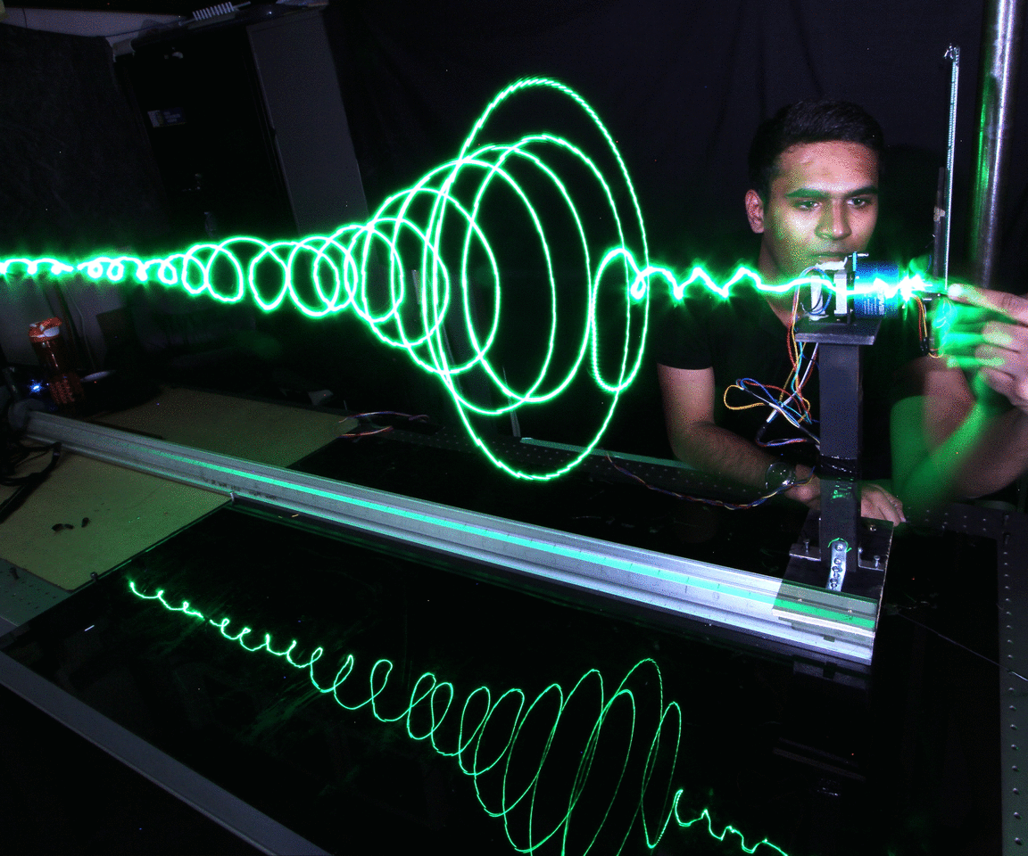 Grasping Gravitational Waves: Augmented Reality Robots Teach Physics Fundamentals to Children and Adults Alike