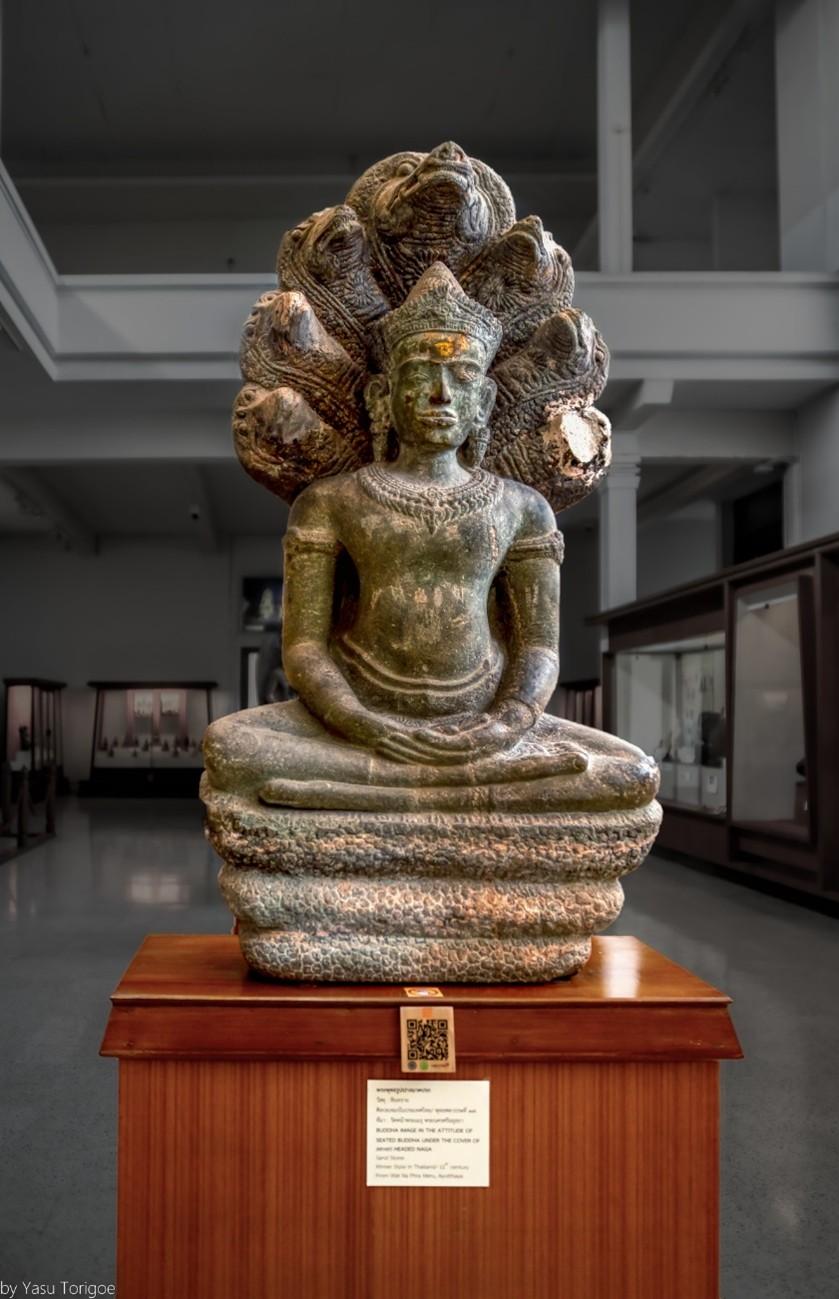Buddha Meditating Under a Naga