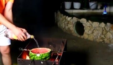 Cut Off the Top of a Watermelon, Remove Flesh, and Put Frozen Ravioli Inside the Watermelon.