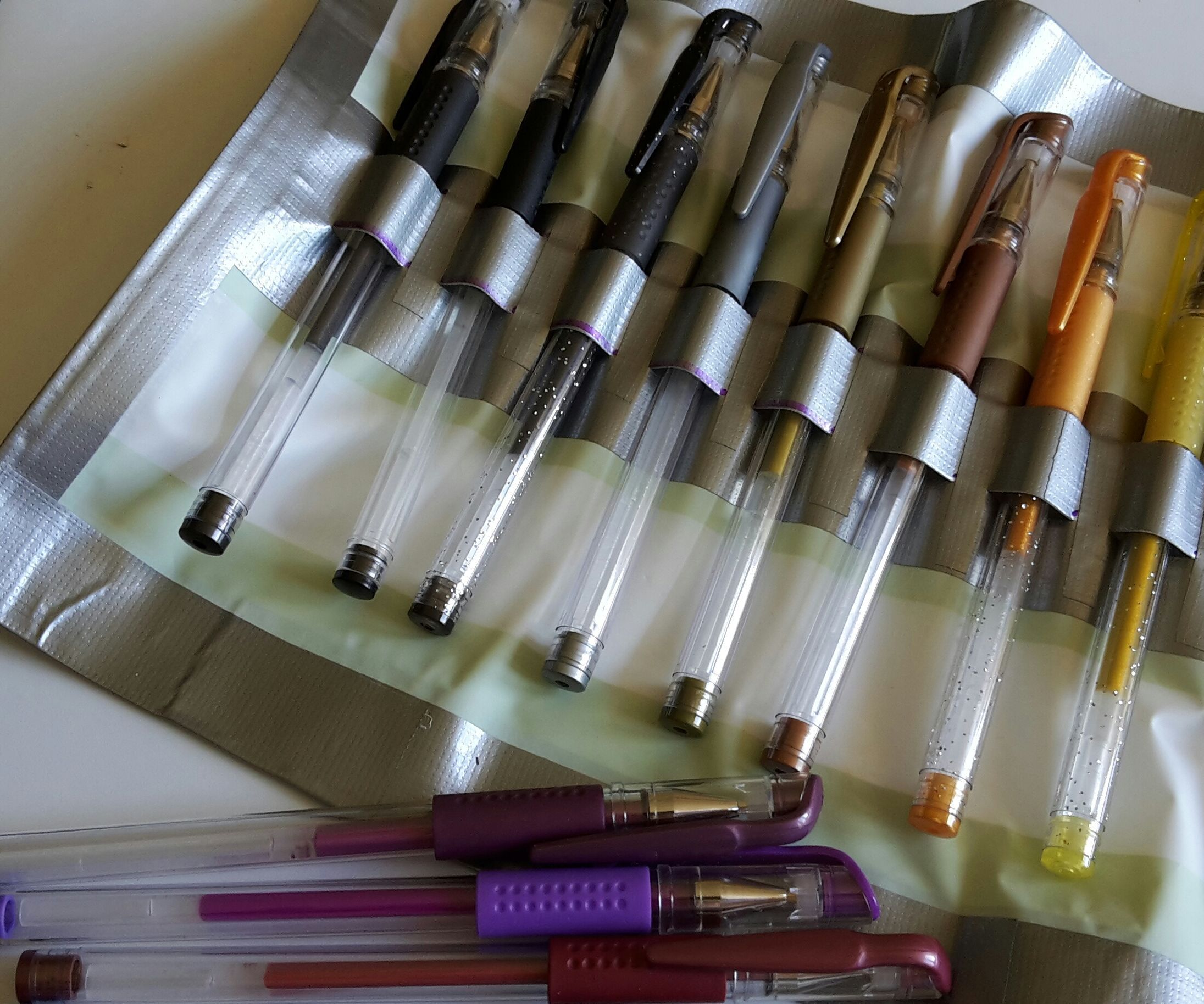 Pencil/pen Roll Made From a Shower Curtain and Duct Tape