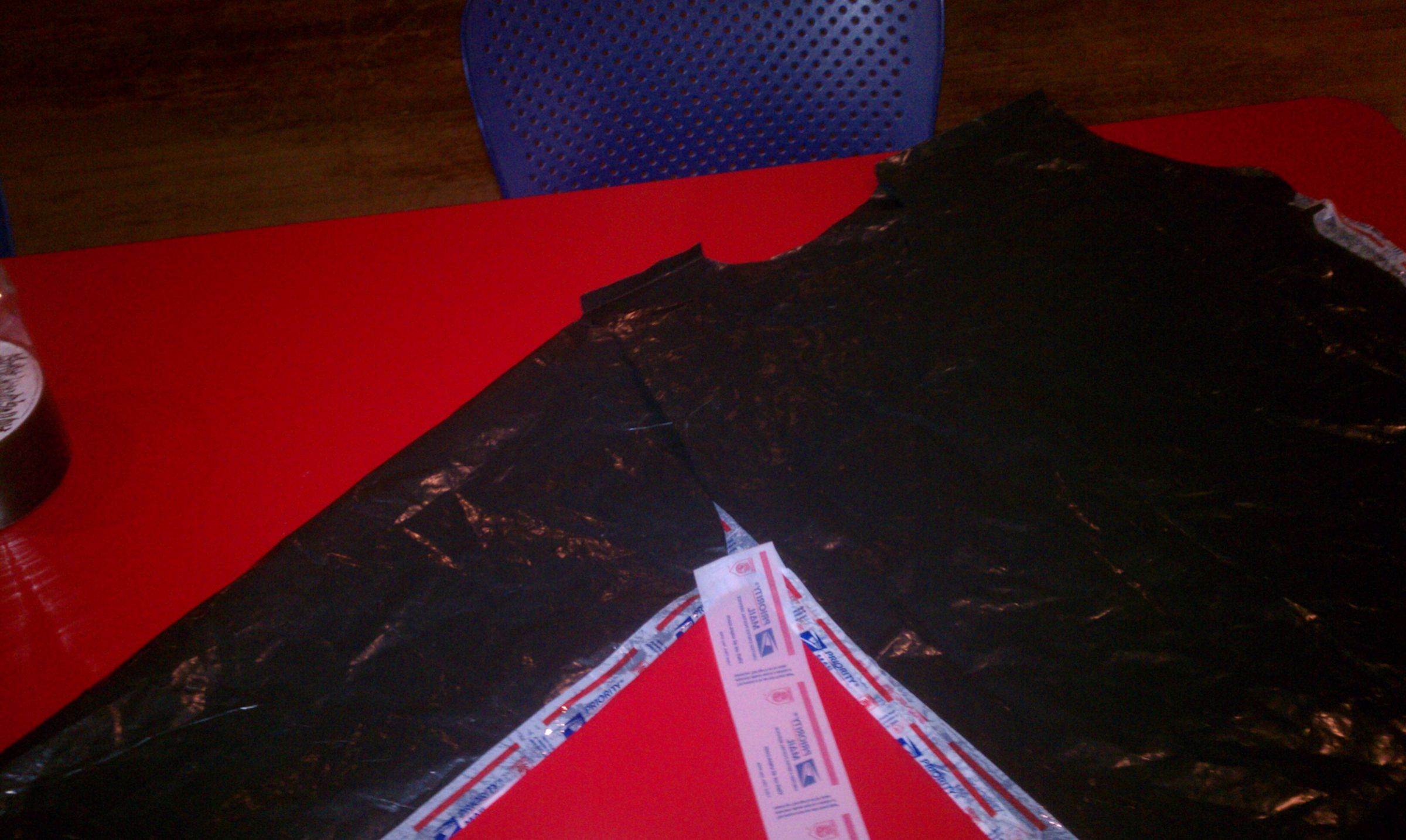 Quick Stylish Raincoat Out of Garbage Bag and USPS Tape 7