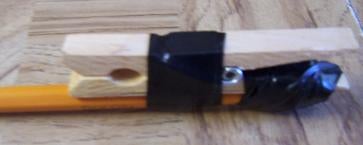 Taping the Front of the Clothes Pin to the Pencil