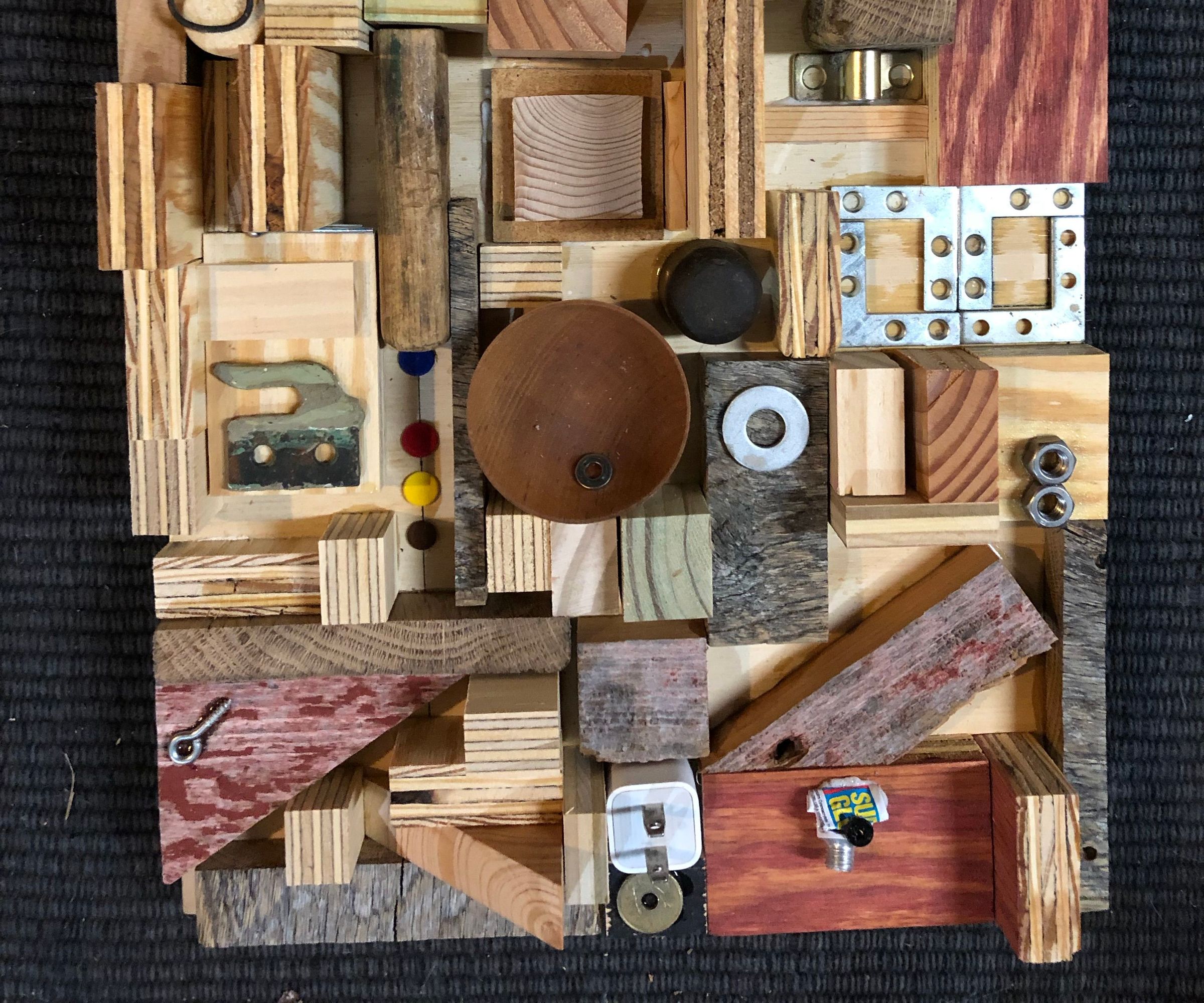 Random Found Items Glued to Plywood