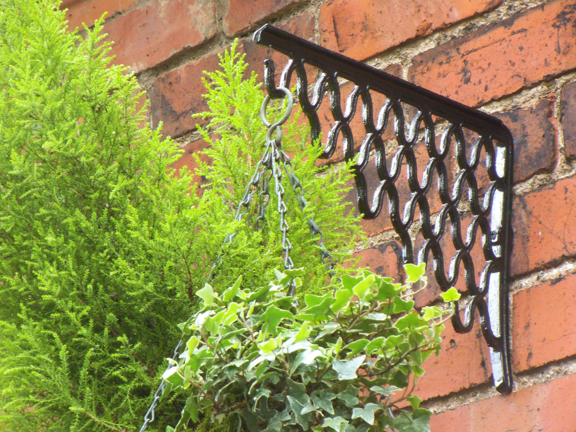 CAST IRON HANGING BASKET BRACKETS FROM OLD SEWING MACHINE TREADLE 3