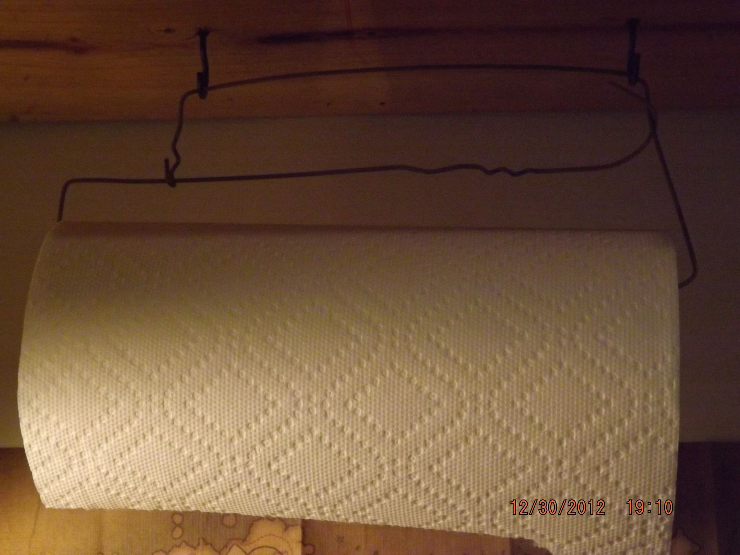 Turn an Old Hanger Into Paper Towel Holder