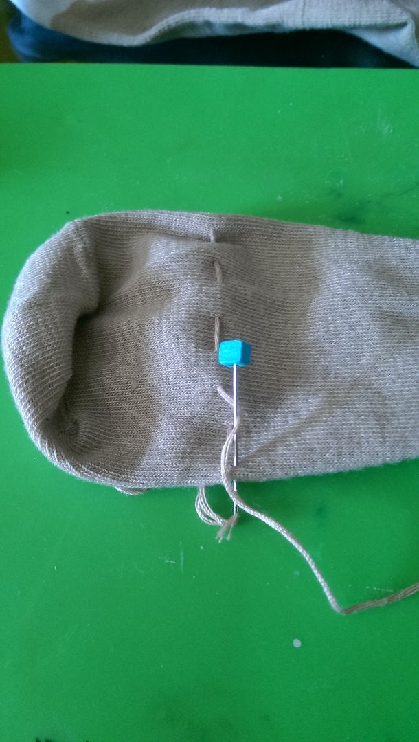 Sew a Running Stitch Around the Foot of the Sock 