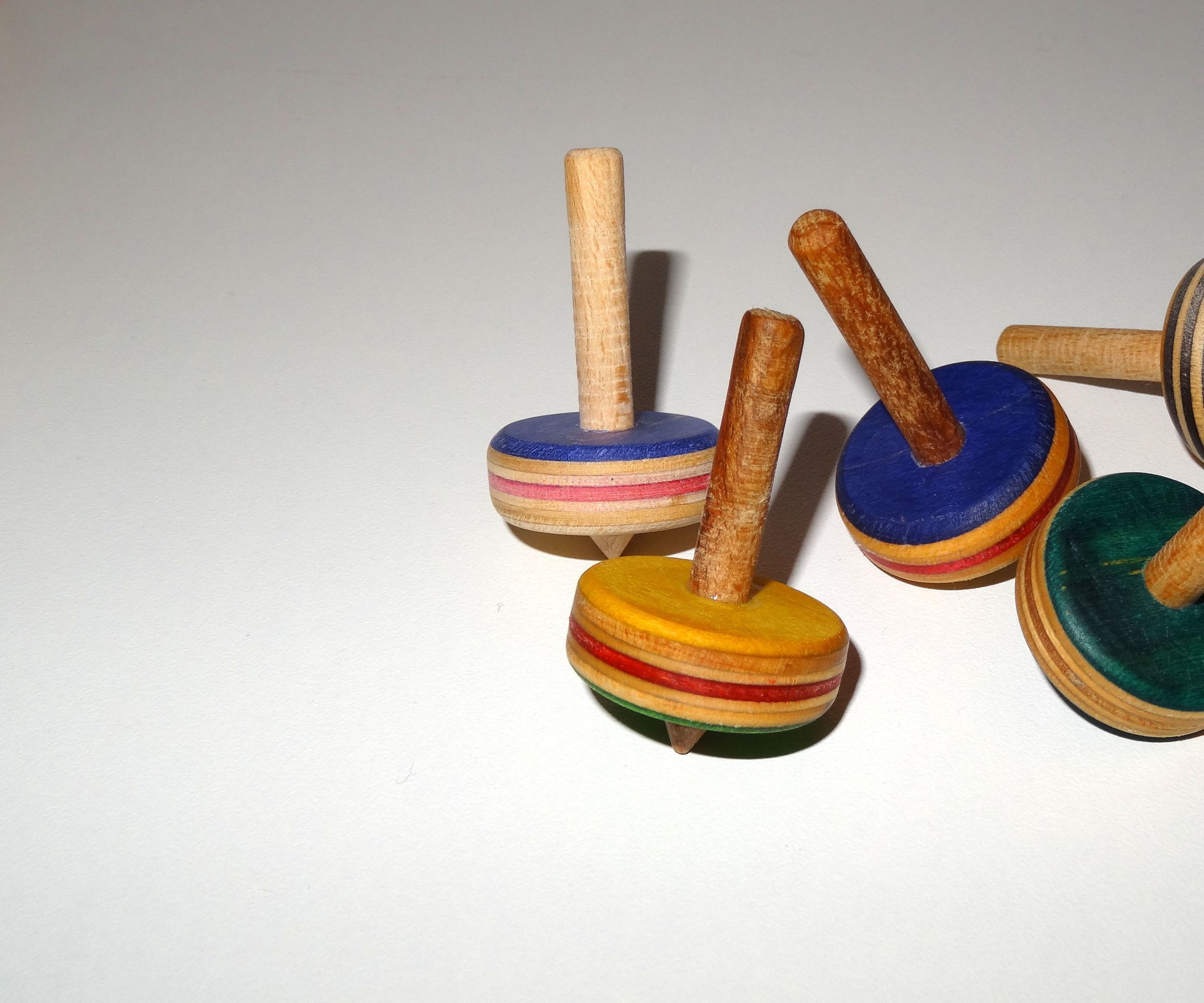 Wooden Spinning Tops Out of Recycled Skateboards