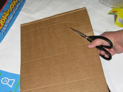 Build Up the Shape of the Shark Around the Balloon Using Cardboard