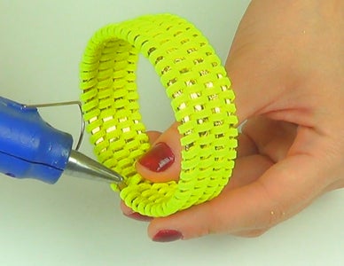 Take 4 Thin Bangles From the Set and Start to Insert the Leather Lace Among Them, in a Meandering Way. 