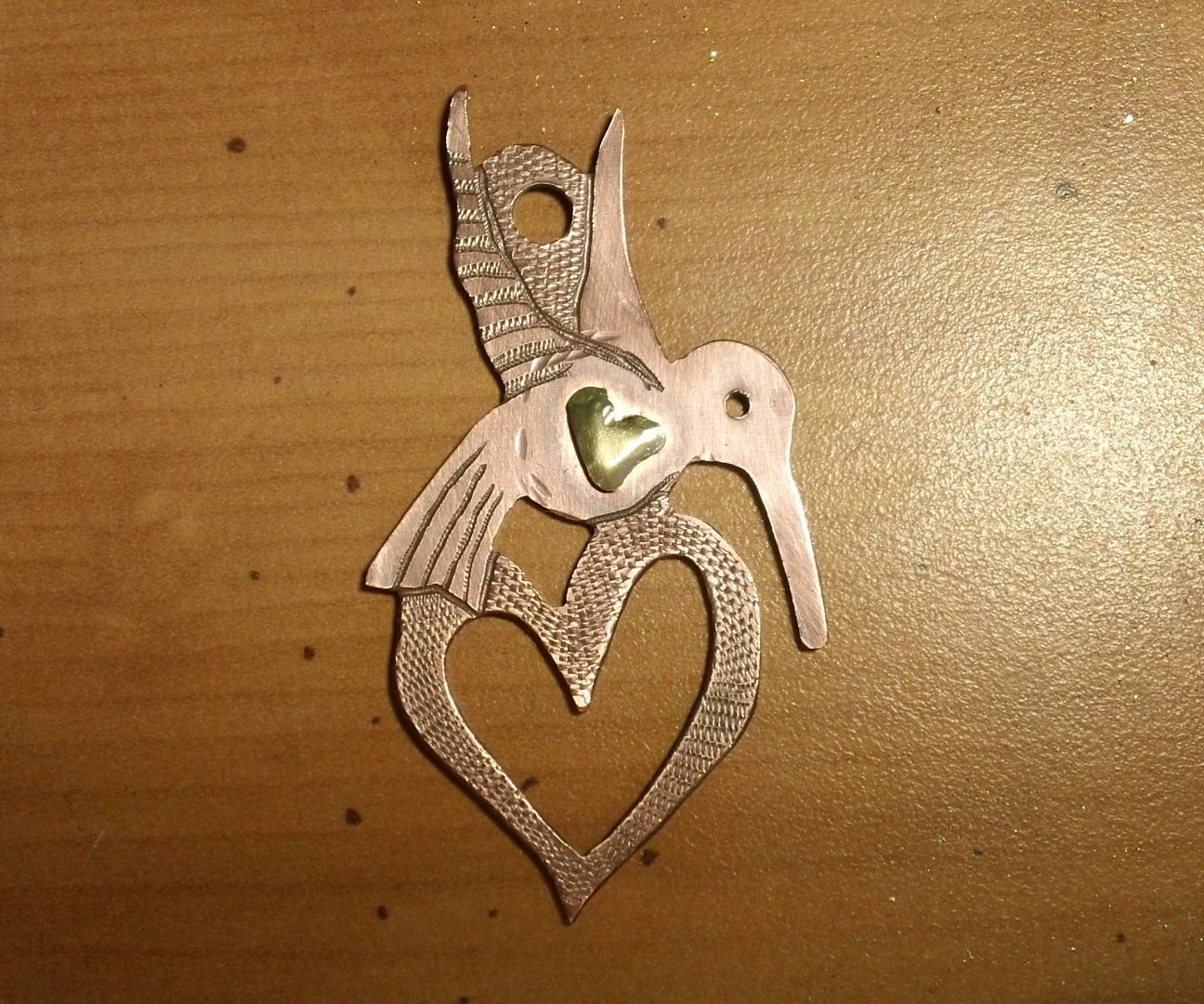 Saw Pierced Hummingbird Memento pendant