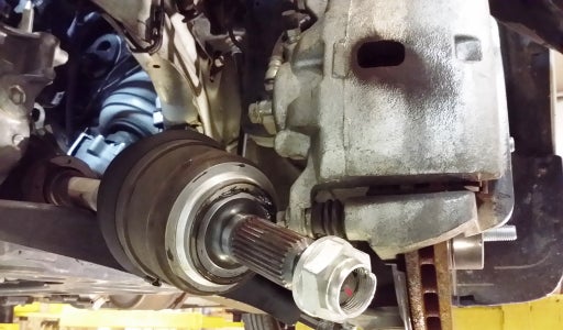 Drain Transmission, Disconnect Control Arms, and Remove Left Axle