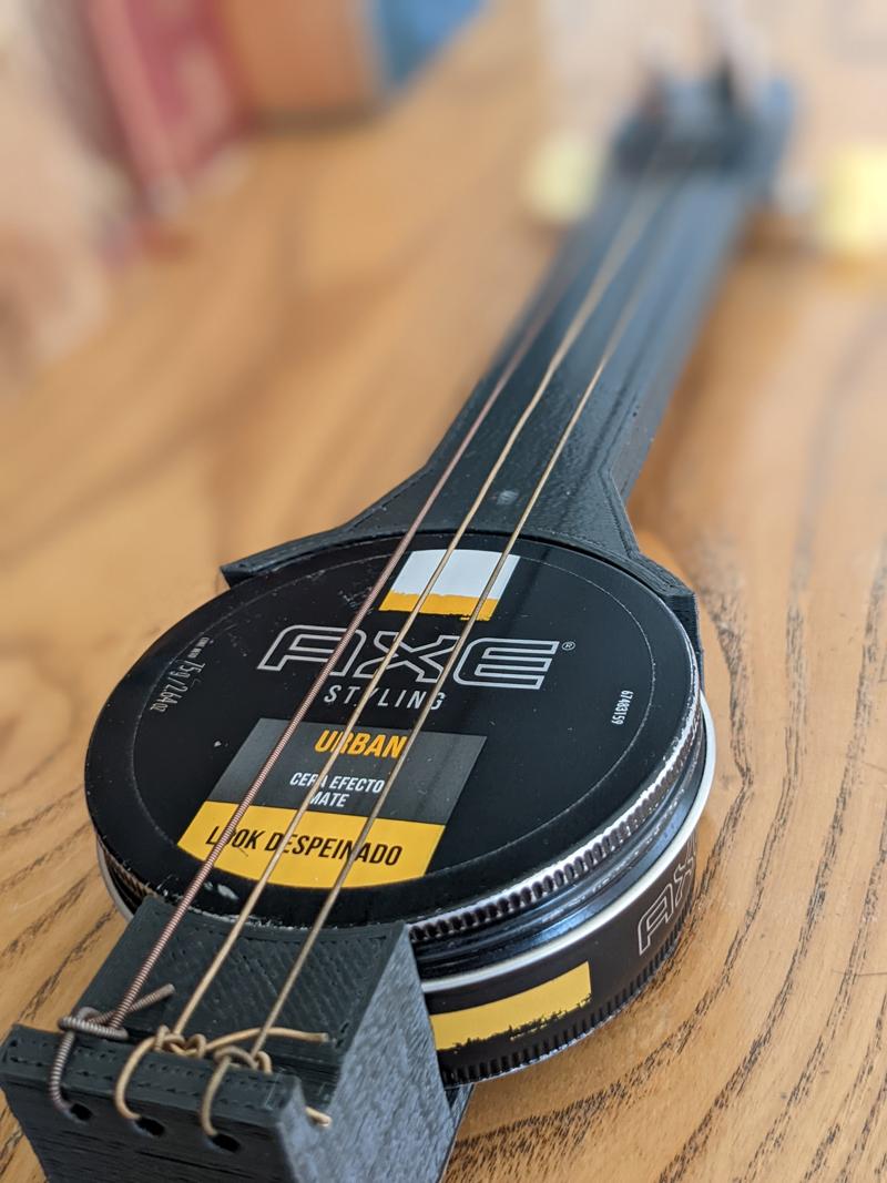 How to Play the Wax Tin Guitar