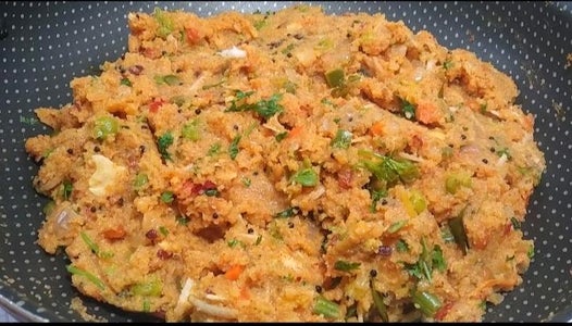 Adding Water Cooking and Serving Khara Bath. 