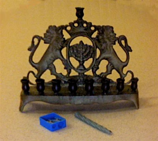 Chanukah candles -- fitting a large candle in a small hole