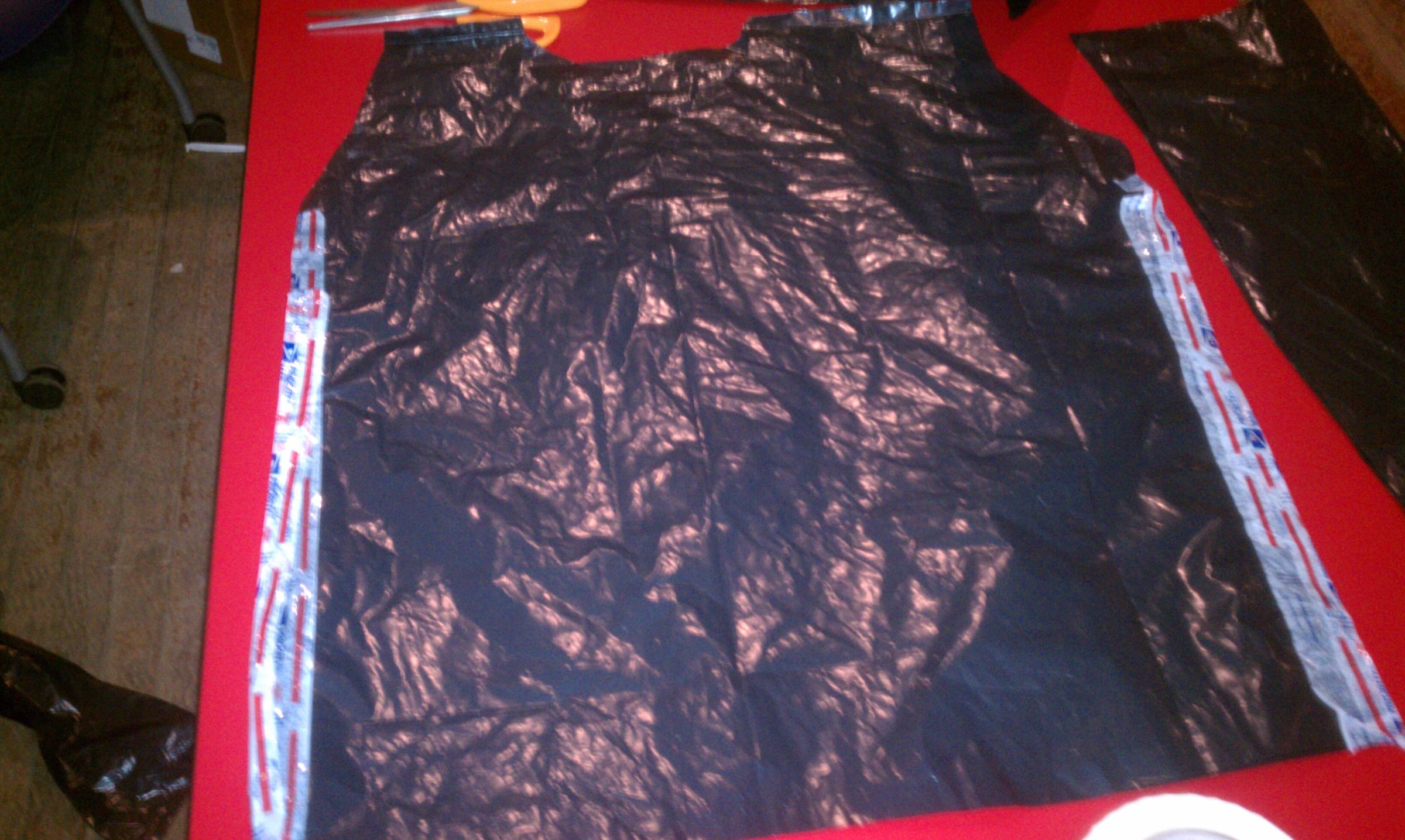 Quick Stylish Raincoat Out of Garbage Bag and USPS Tape 7