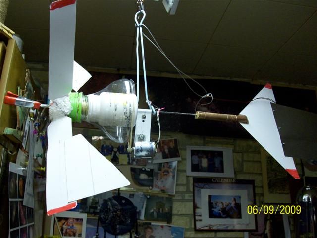 LED LIT GARDEN WHIRLIGIG USING WIND POWER.