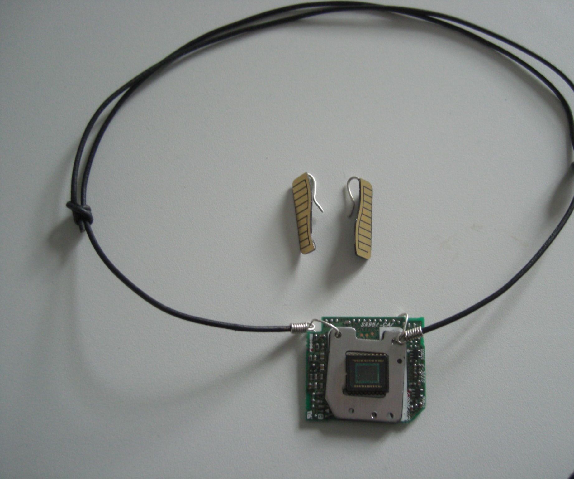 reusing old camera parts for jewelry