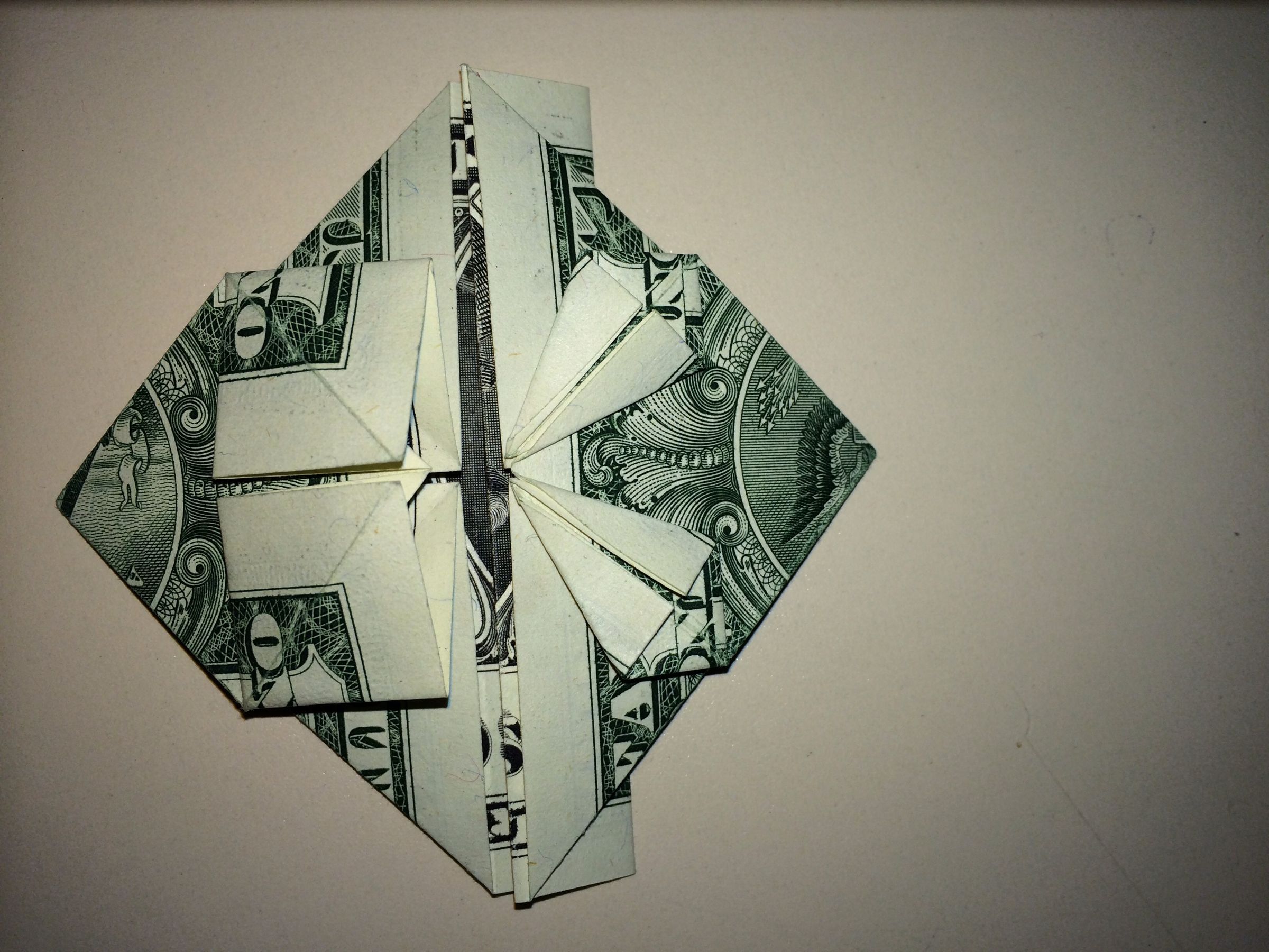 Dollar Origami Heart Holding Quarter : 11 Steps - Instructables