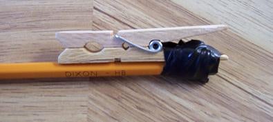 Taping the Clothes Pin to the Pencil